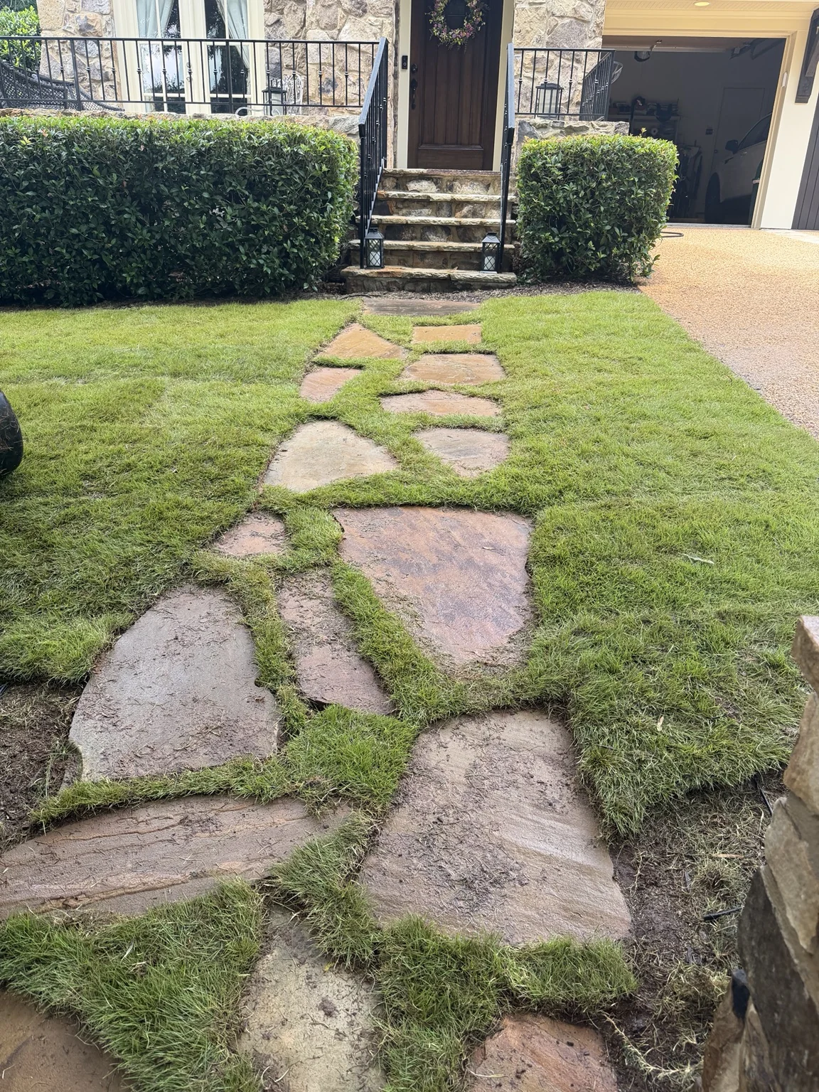 Flagstone walkway with sod